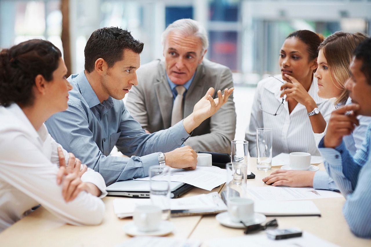 A group meeting around a boardroom table